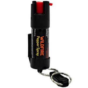 Compact Wildfire pepper spray with belt clip and key chain for self-defense.